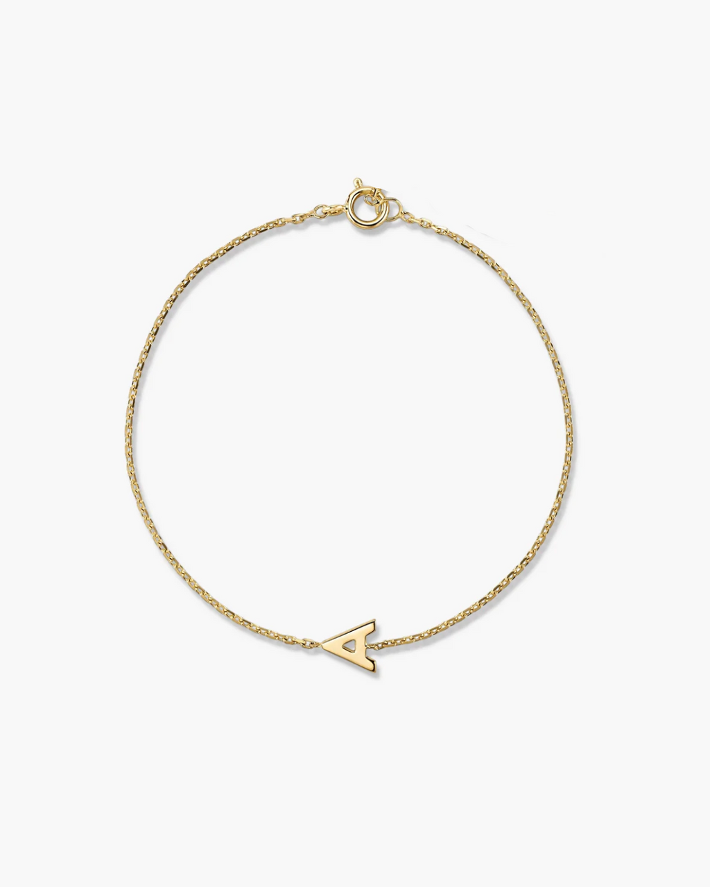 Gold bracelet with a small arrow charm on a white background