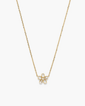 Gold necklace with a delicate flower pendant on a white background