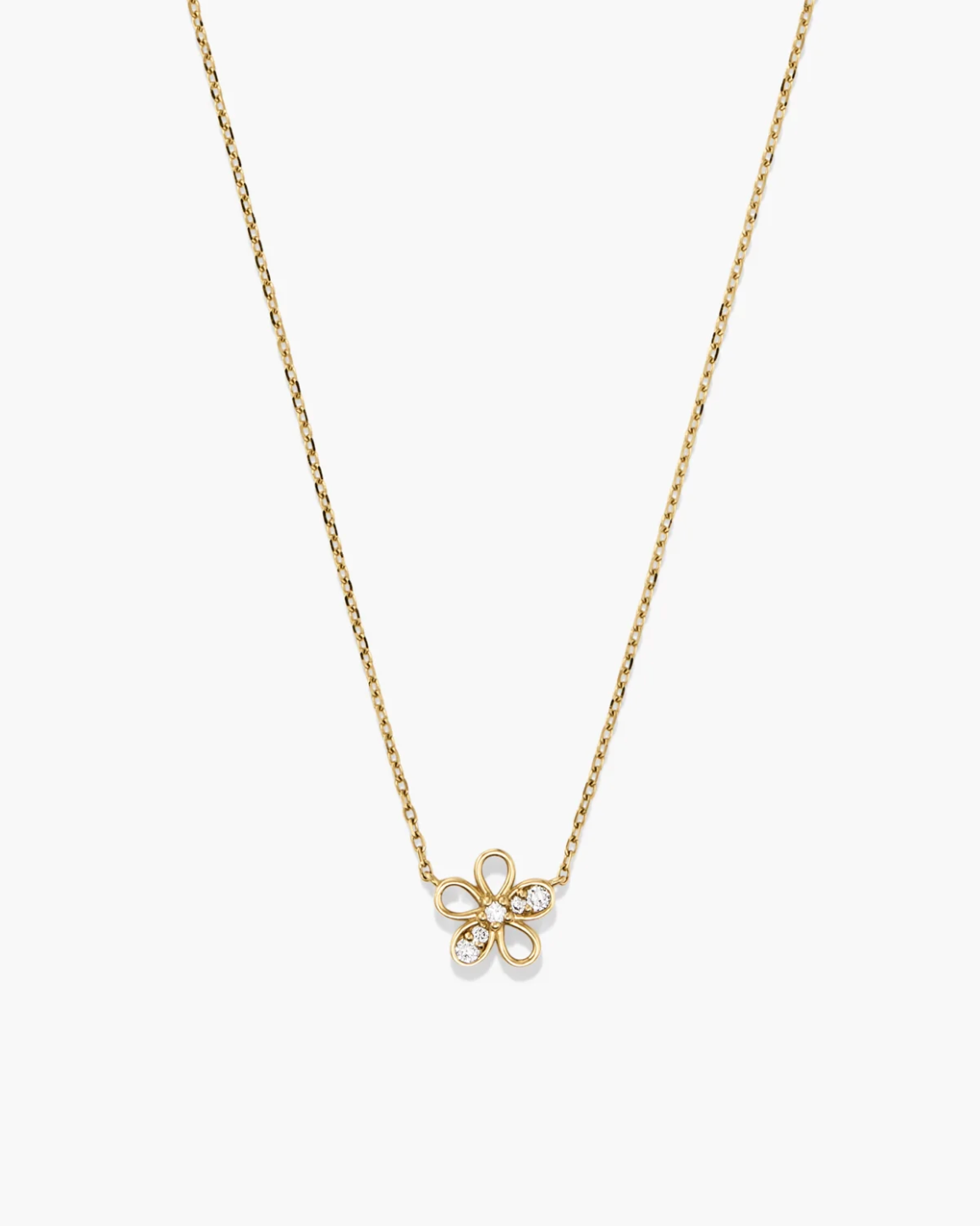 Gold necklace with a delicate flower pendant on a white background