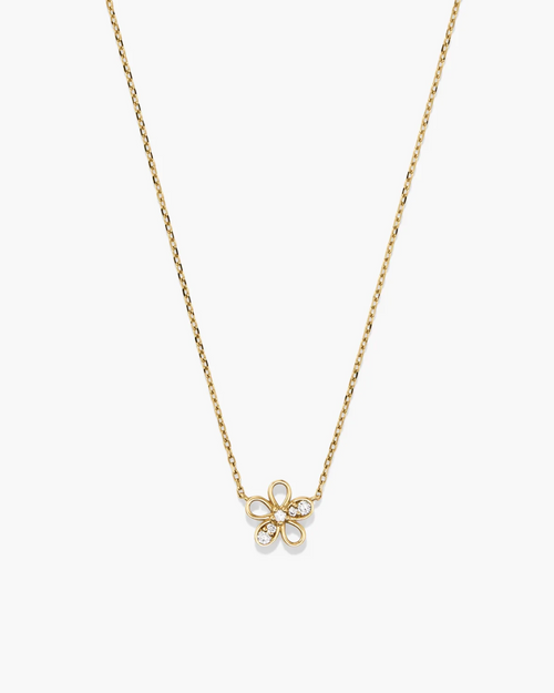 Gold necklace with a delicate flower pendant on a white background