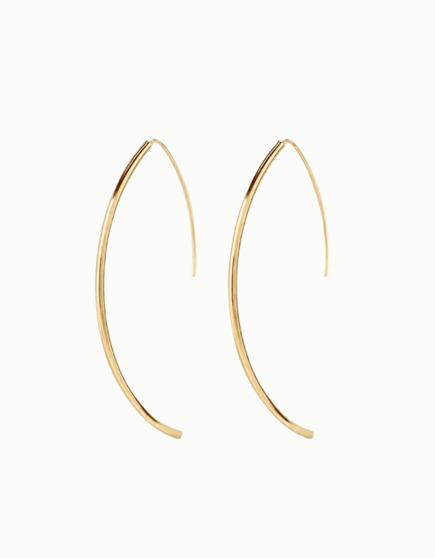 Gold hoop earrings on a white background