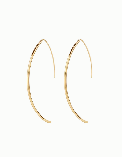 Gold hoop earrings on a white background