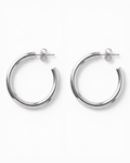 Pair of silver hoop earrings on a white background