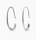 Pair of silver hoop earrings on a white background