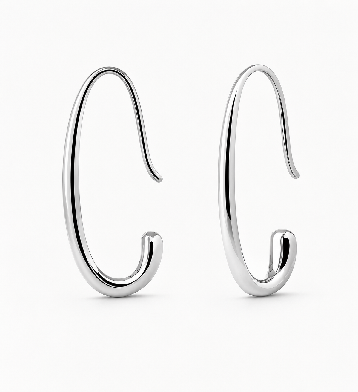 Pair of silver hoop earrings on a white background