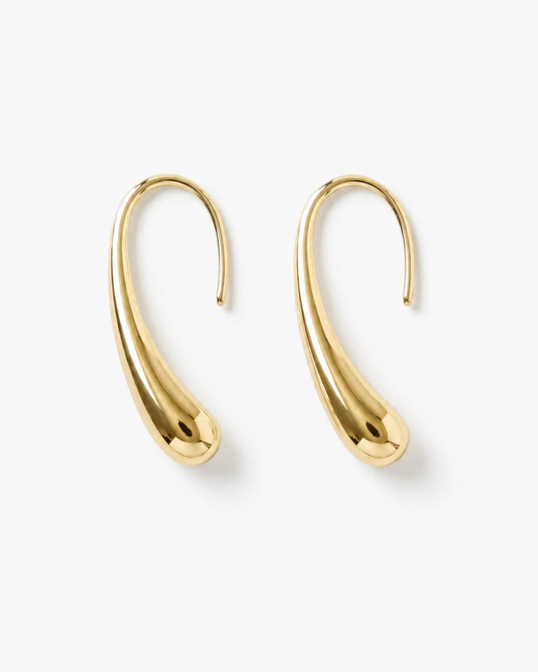 Gold hoop earrings on a white background