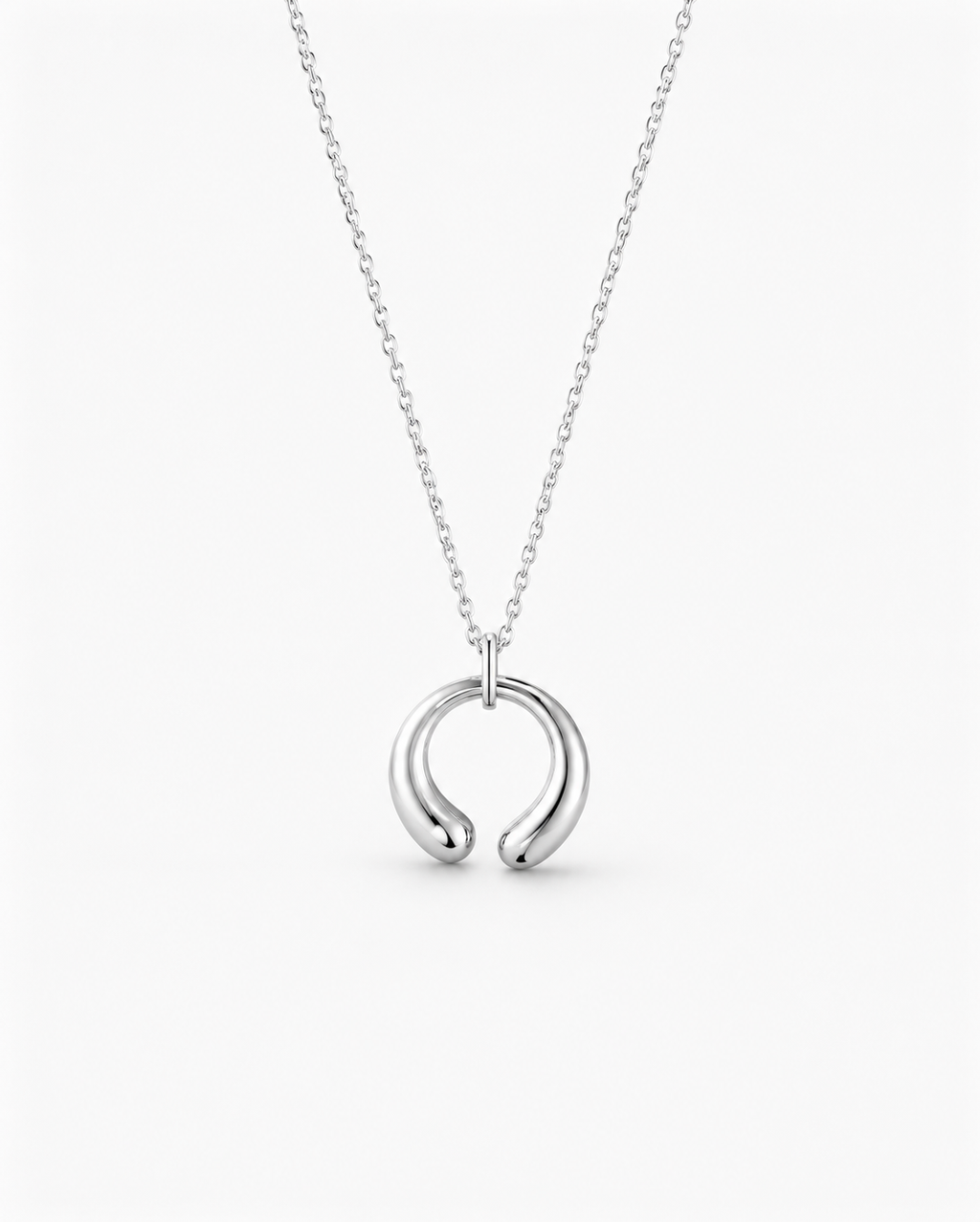 Silver necklace with a unique pendant on a white background