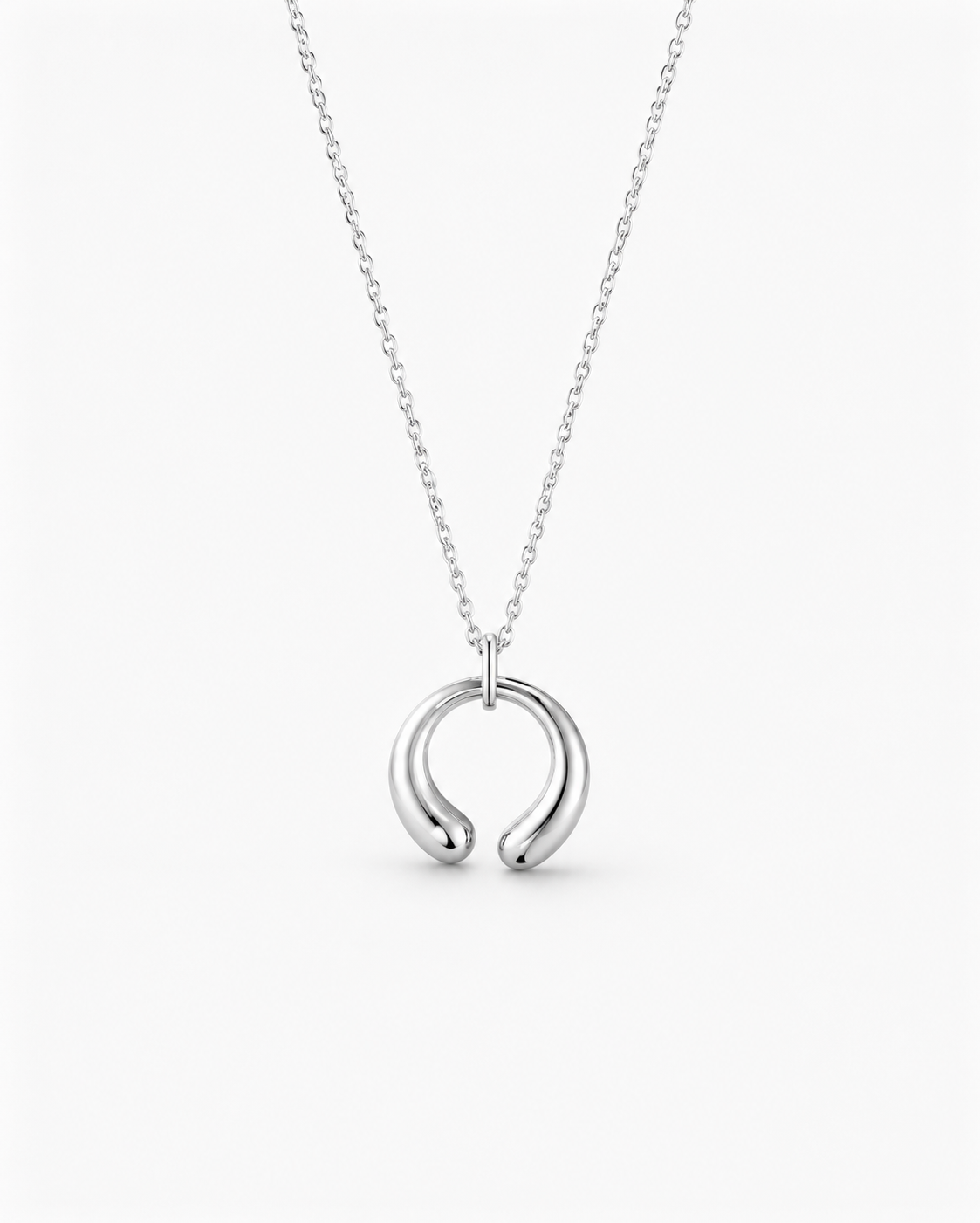 Silver necklace with a unique pendant on a white background