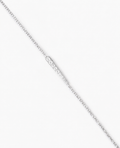 Silver chain necklace on a light gray background
