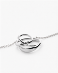 Silver interlocking ring necklace on a white background