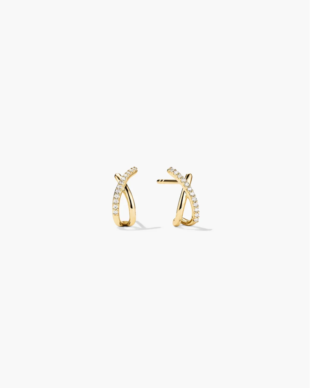 Pair of gold hoop earrings with small diamonds on a white background