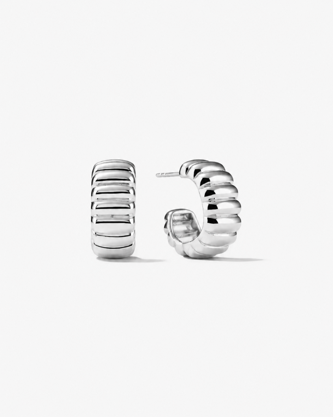 Silver hoop earrings on a white background