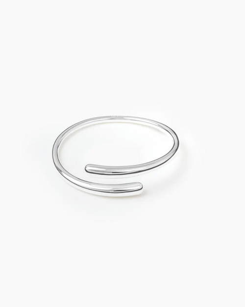 Silver open bangle on a white background